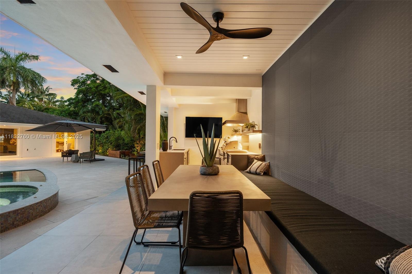 4800 Bay Point Road Miami, FL 33137 - Photo 60 of 74 a dining room with furniture and a fireplace