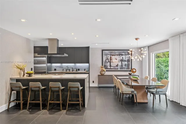 a bedroom with a bed couch and window