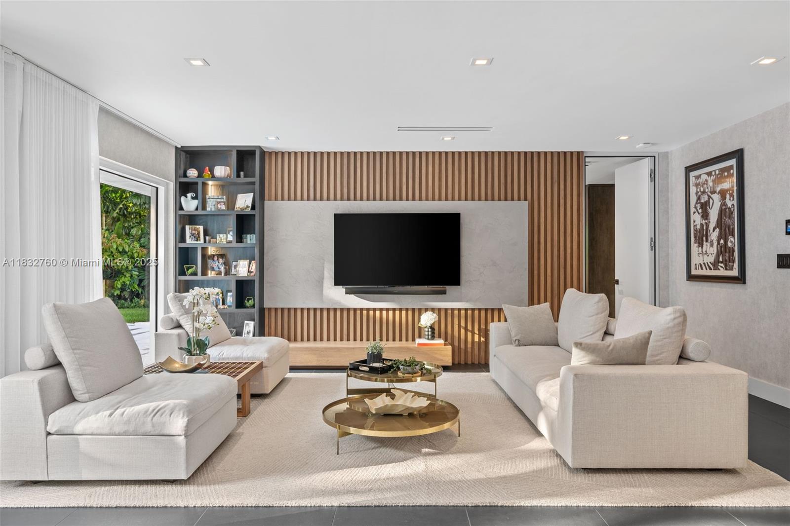 4800 Bay Point Road Miami, FL 33137 - Photo 8 of 74 a living room with furniture flat screen tv and a large window