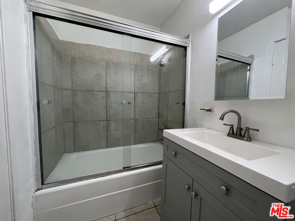 418 West Jackson Street Rialto, CA 92376 - Photo 24 of 24 a bathroom with a sink and a mirror