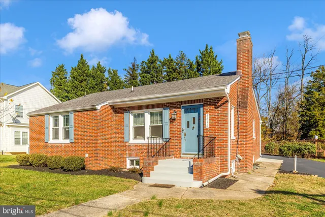 a view of a house with backyard porch and sitting area