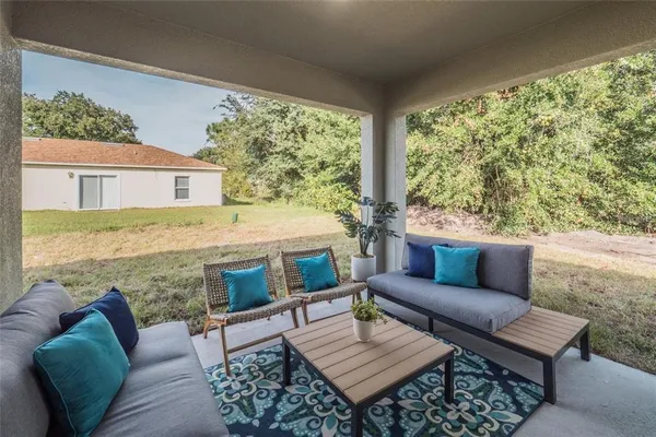 a outdoor living space with furniture and a floor to ceiling window