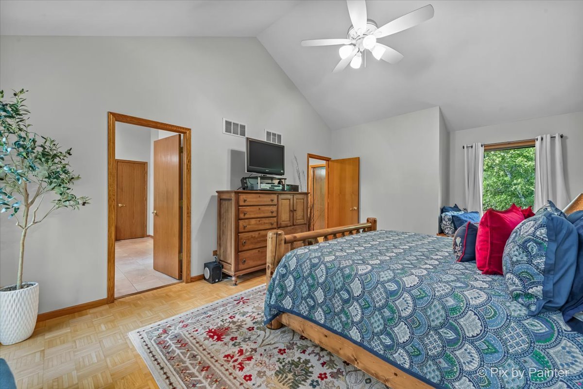 28971 Fox Street Cary, IL 60013 - Photo 21 of 51 a bedroom with a bed and a dresser with wooden floor