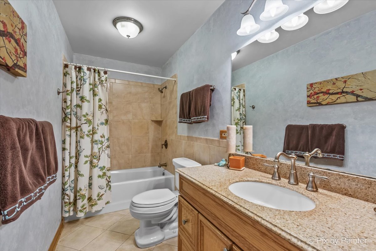 28971 Fox Street Cary, IL 60013 - Photo 26 of 51 a bathroom with a granite countertop double vanity sink mirror and toilet