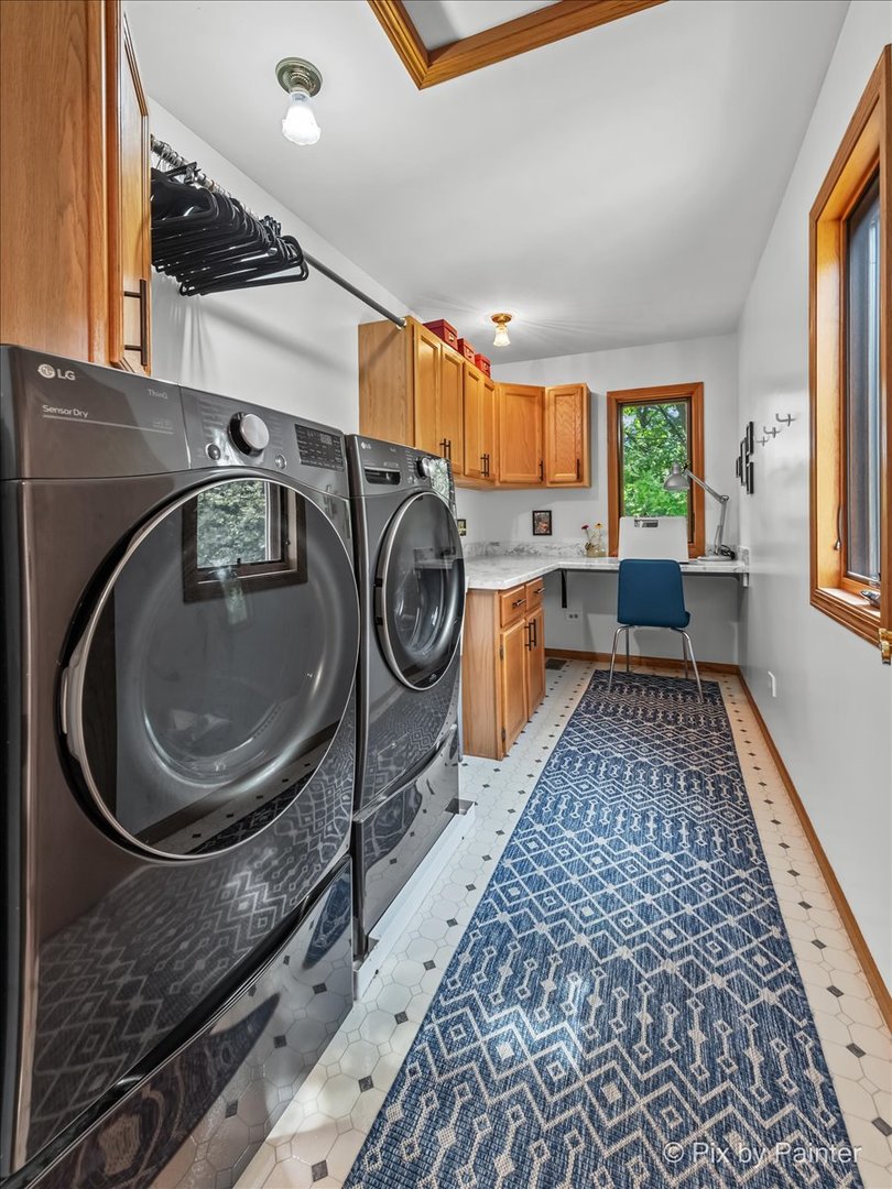 28971 Fox Street Cary, IL 60013 - Photo 30 of 51 a bathroom with a sink a mirror and window