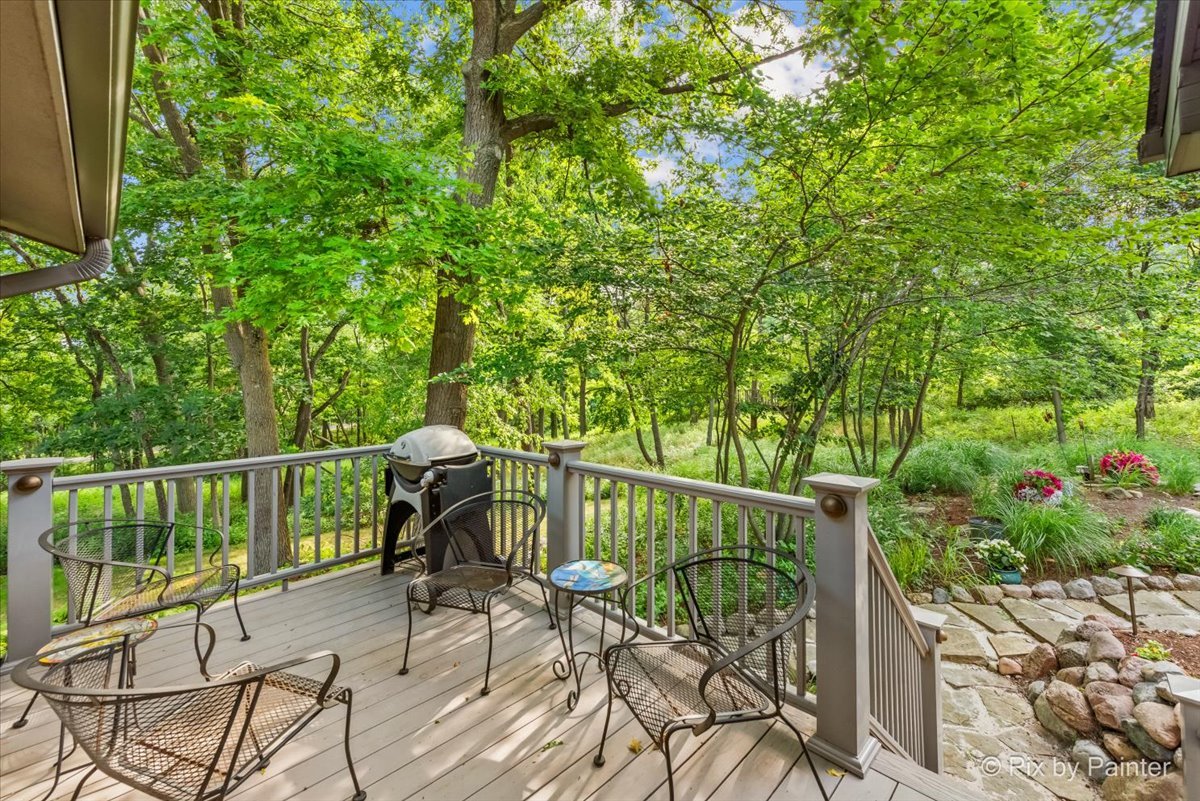 28971 Fox Street Cary, IL 60013 - Photo 34 of 51 a view of a balcony with chairs and wooden fence