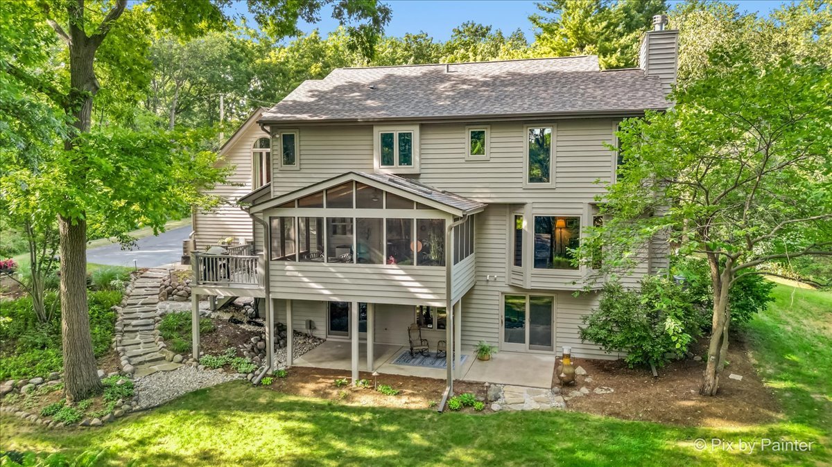 28971 Fox Street Cary, IL 60013 - Photo 39 of 51 a front view of a house with a yard table and chairs