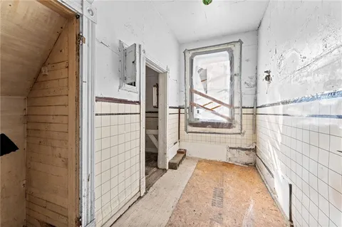 a bathroom with a bathtub and shower