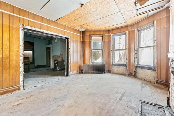 a view of an empty room with a fireplace