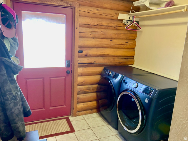 76 Highway 118 Monroe, UT 84754 - Photo 57 of 76 Laundry room featuring rustic walls, light tile patterned floors, and separate washer and dryer