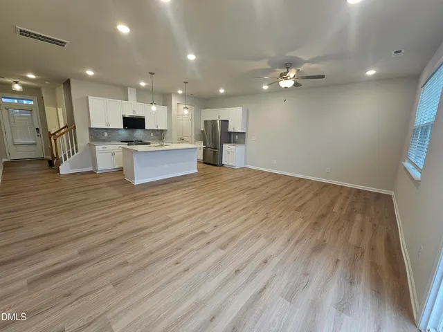 a view of a living room and kitchen