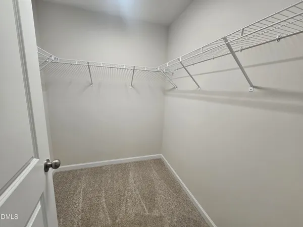 a bathroom with a shower sink and mirror