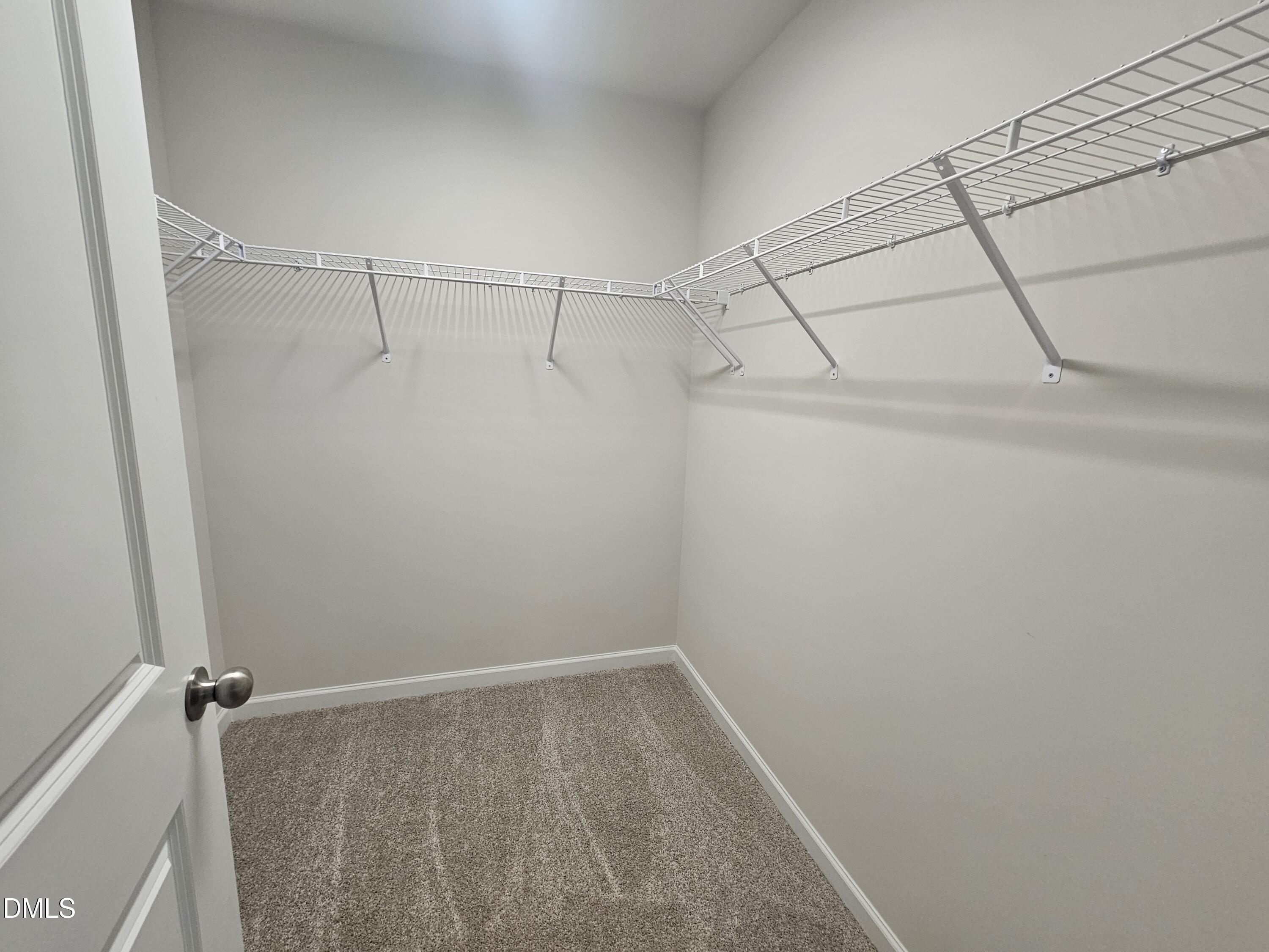 111 Siebold Street Garner, NC 27529 - Photo 16 of 25 a view of a room with racks on the wall