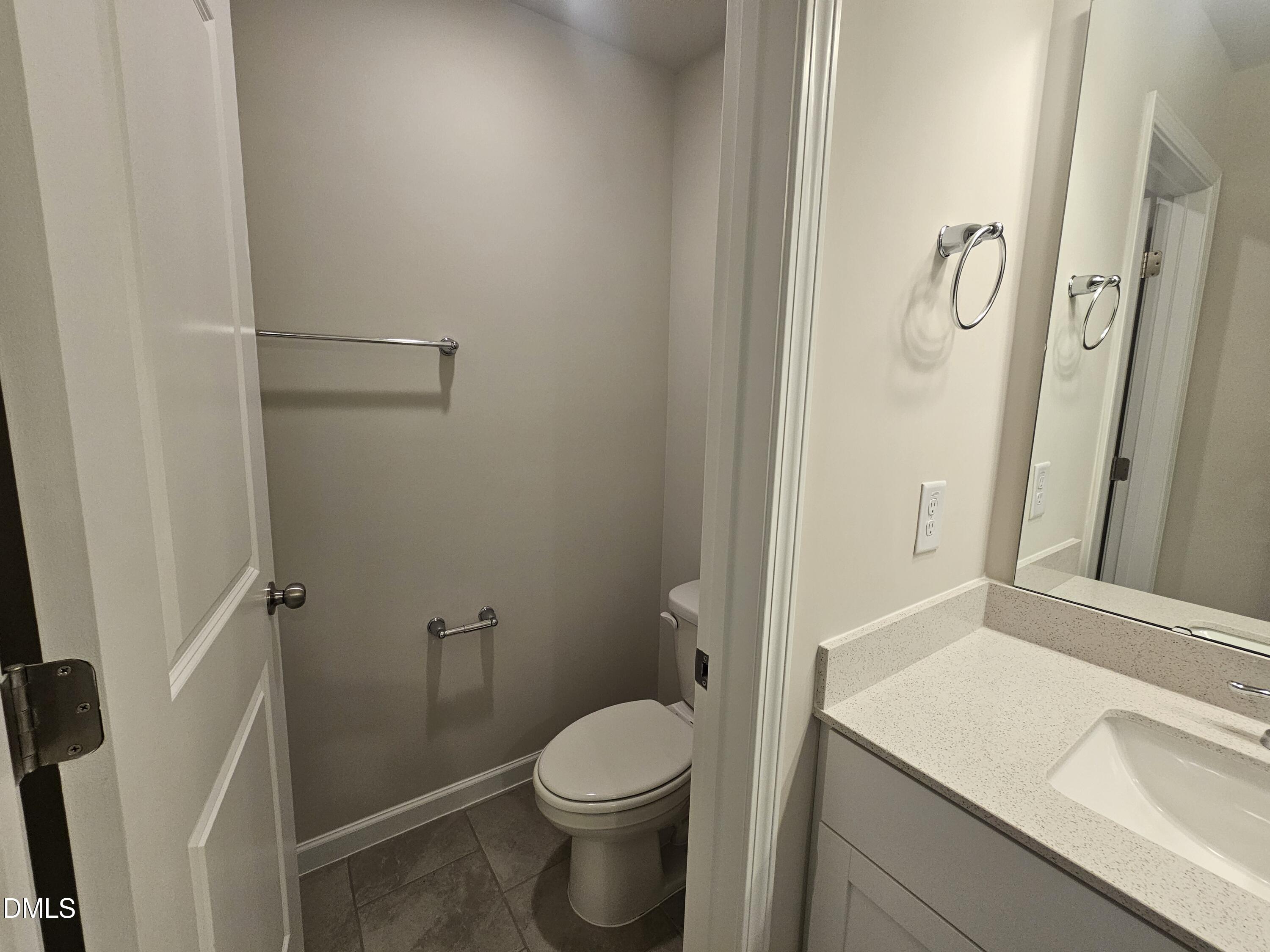 111 Siebold Street Garner, NC 27529 - Photo 20 of 25 a bathroom with a granite countertop sink toilet and shower