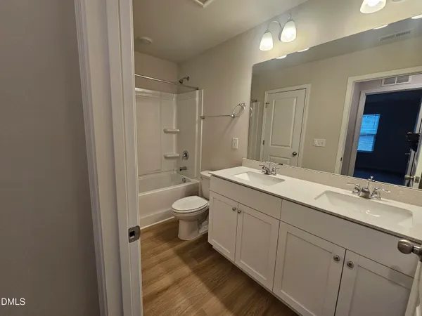 a bathroom with a toilet and a bathtub