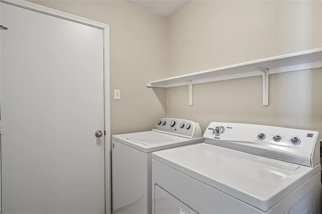 a utility room with dryer and washer