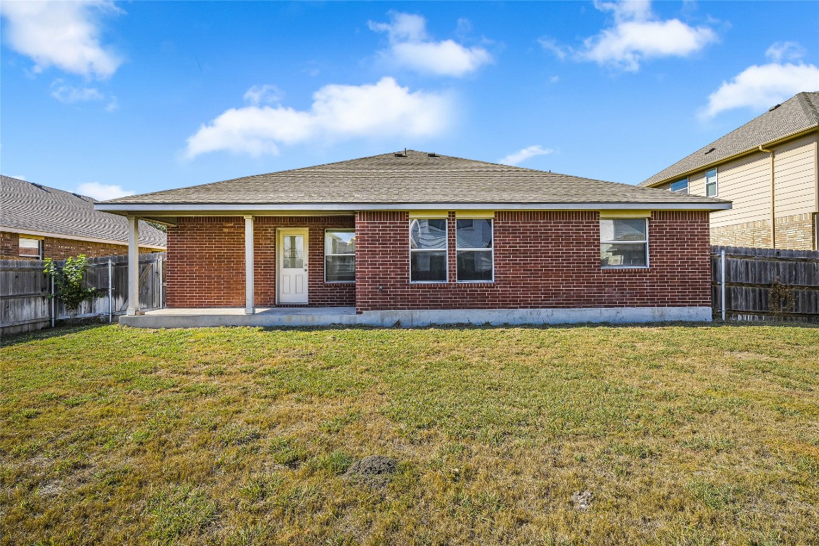 20009 Hawk Hood Drive Pflugerville, TX 78660 - Photo 15 of 16 a front view of a house with a garden