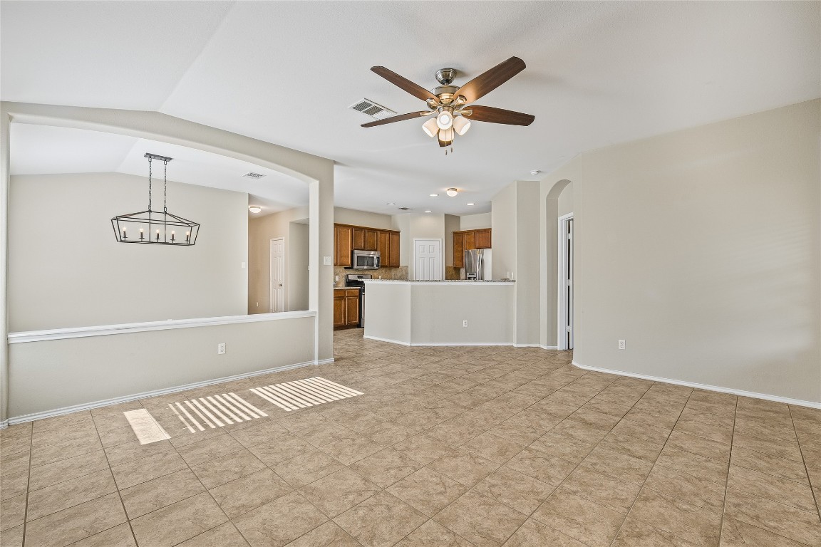 20009 Hawk Hood Drive Pflugerville, TX 78660 - Photo 3 of 16 a view of a livingroom with a ceiling fan and window