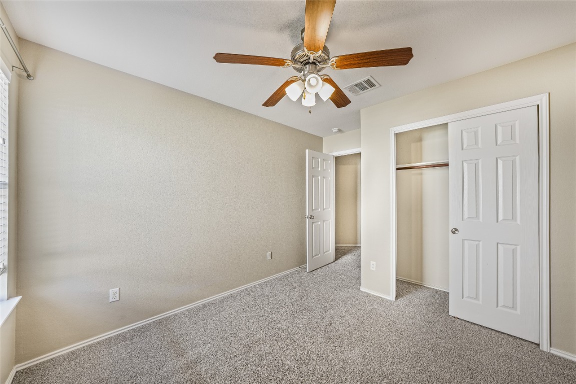 20009 Hawk Hood Drive Pflugerville, TX 78660 - Photo 9 of 16 wooden floor in an empty room with a chandelier fan