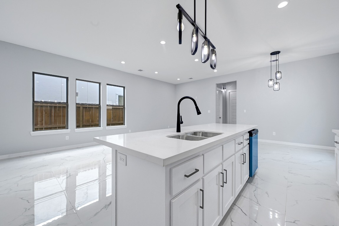 90 Burress Street, Unit B Houston, TX 77022 - Photo 11 of 31 a view of a kitchen with a sink and chandelier