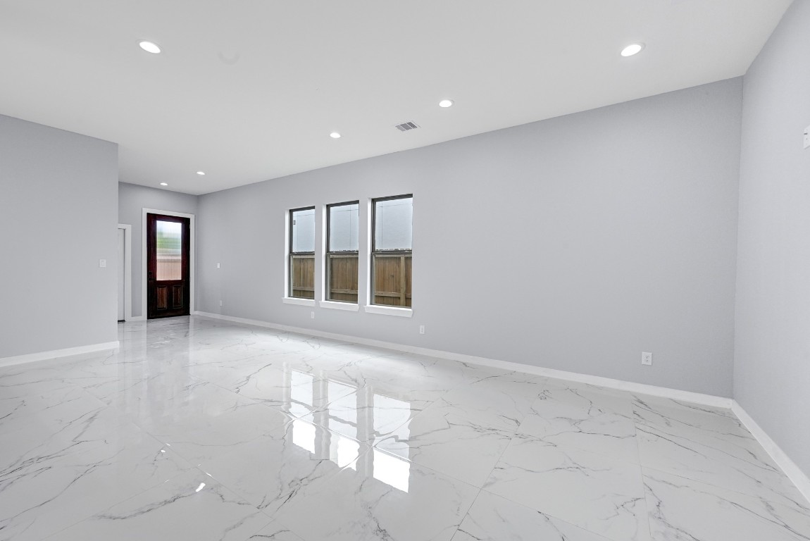 90 Burress Street, Unit B Houston, TX 77022 - Photo 13 of 31 an empty room with windows