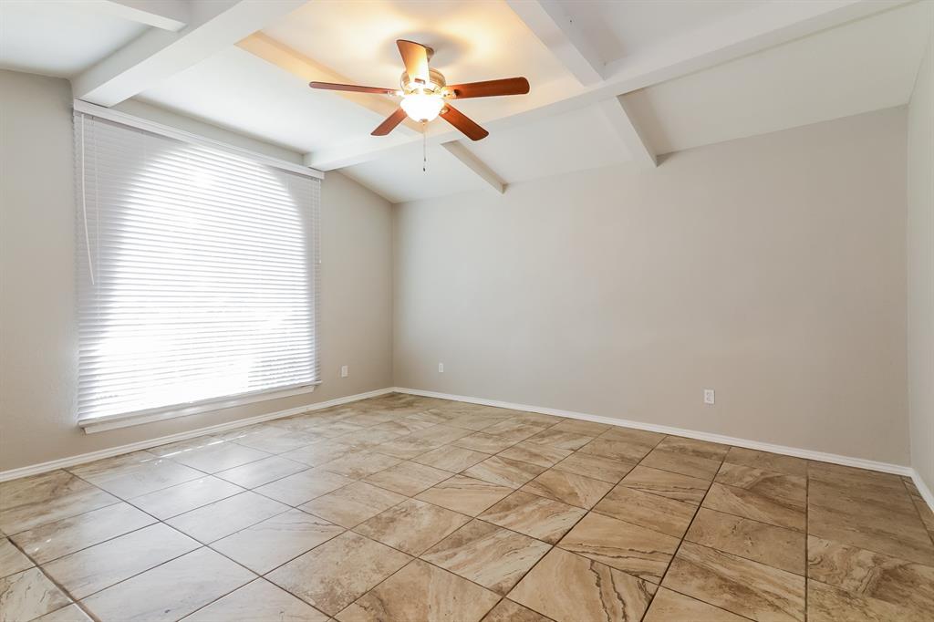 4821 Ashbrook Road Dallas, TX 75227 - Photo 15 of 21 an empty room with windows and ceiling fan