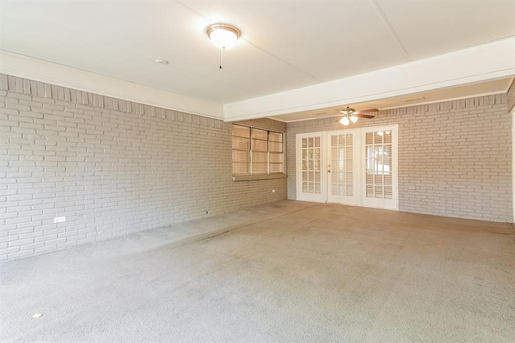 4821 Ashbrook Road Dallas, TX 75227 - Photo 16 of 21 a view of an empty room with a window