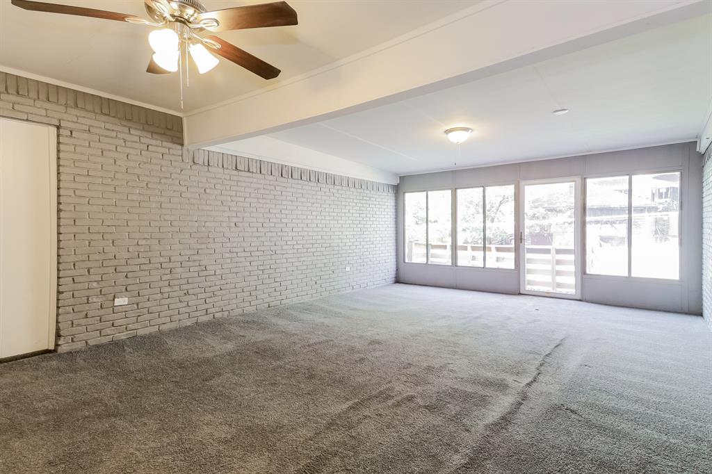 4821 Ashbrook Road Dallas, TX 75227 - Photo 17 of 21 a view of an empty room with a window