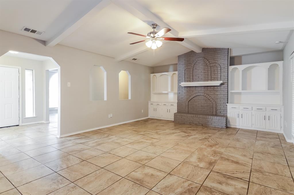 4821 Ashbrook Road Dallas, TX 75227 - Photo 3 of 21 a view of a livingroom with a ceiling fan and window