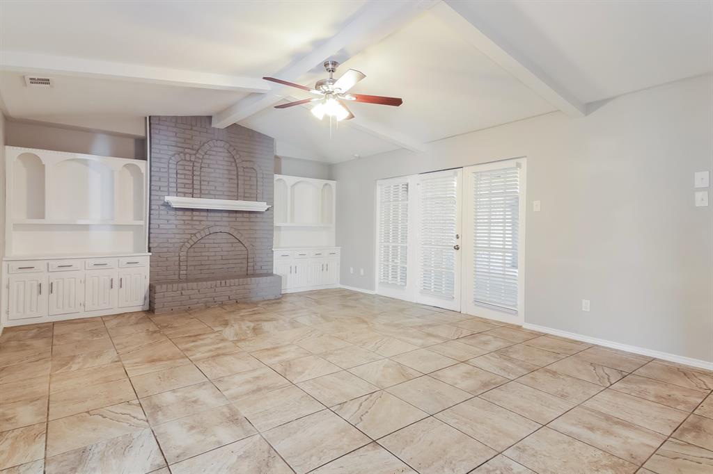 4821 Ashbrook Road Dallas, TX 75227 - Photo 4 of 21 a view of a livingroom with a ceiling fan and window