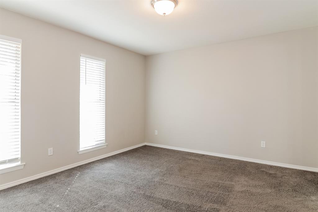4821 Ashbrook Road Dallas, TX 75227 - Photo 8 of 21 an empty room with a window