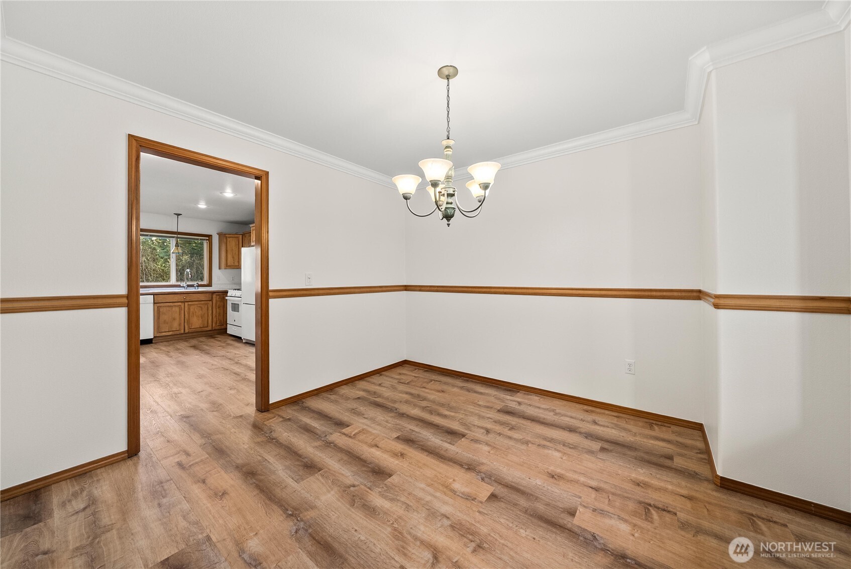 7626 78th Loop Northwest Olympia, WA 98502 - Photo 12 of 38 a view of an empty room with wooden floor