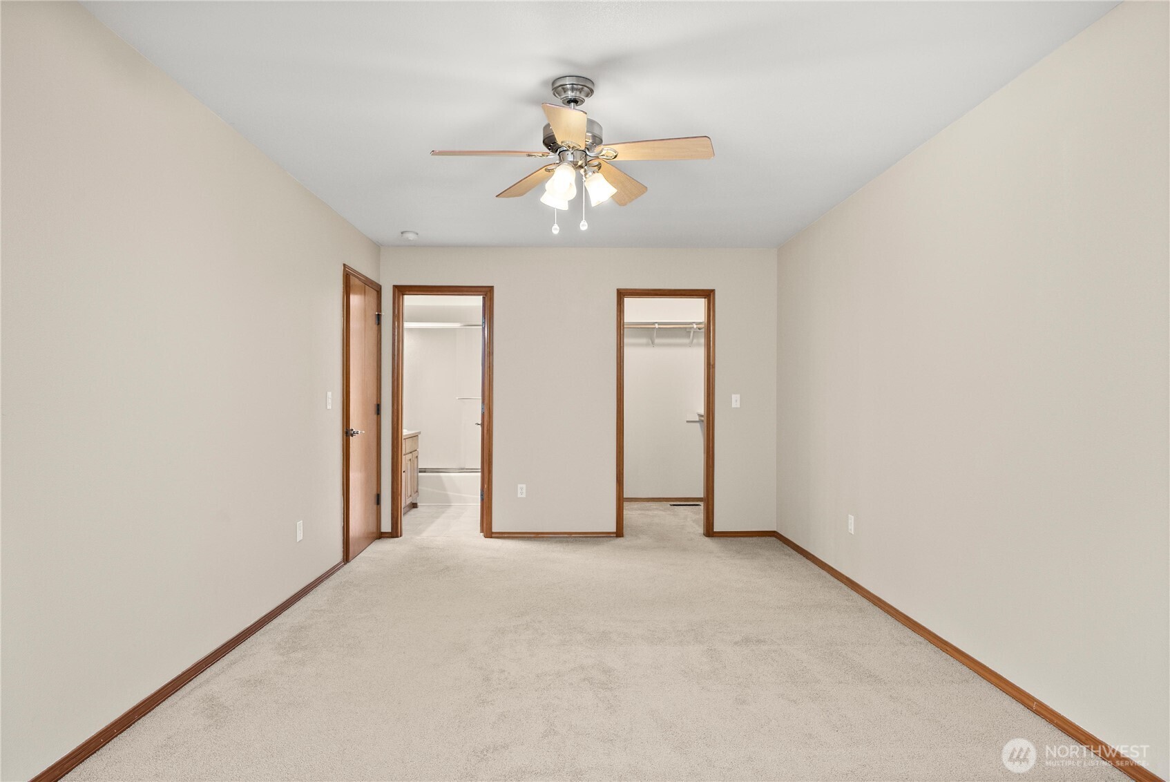7626 78th Loop Northwest Olympia, WA 98502 - Photo 18 of 38 an empty room with chandelier fan and windows