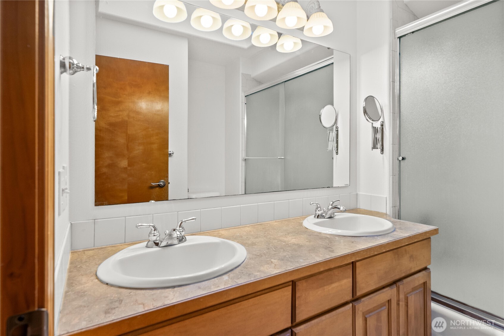 7626 78th Loop Northwest Olympia, WA 98502 - Photo 19 of 38 a bathroom with a sink and a mirror