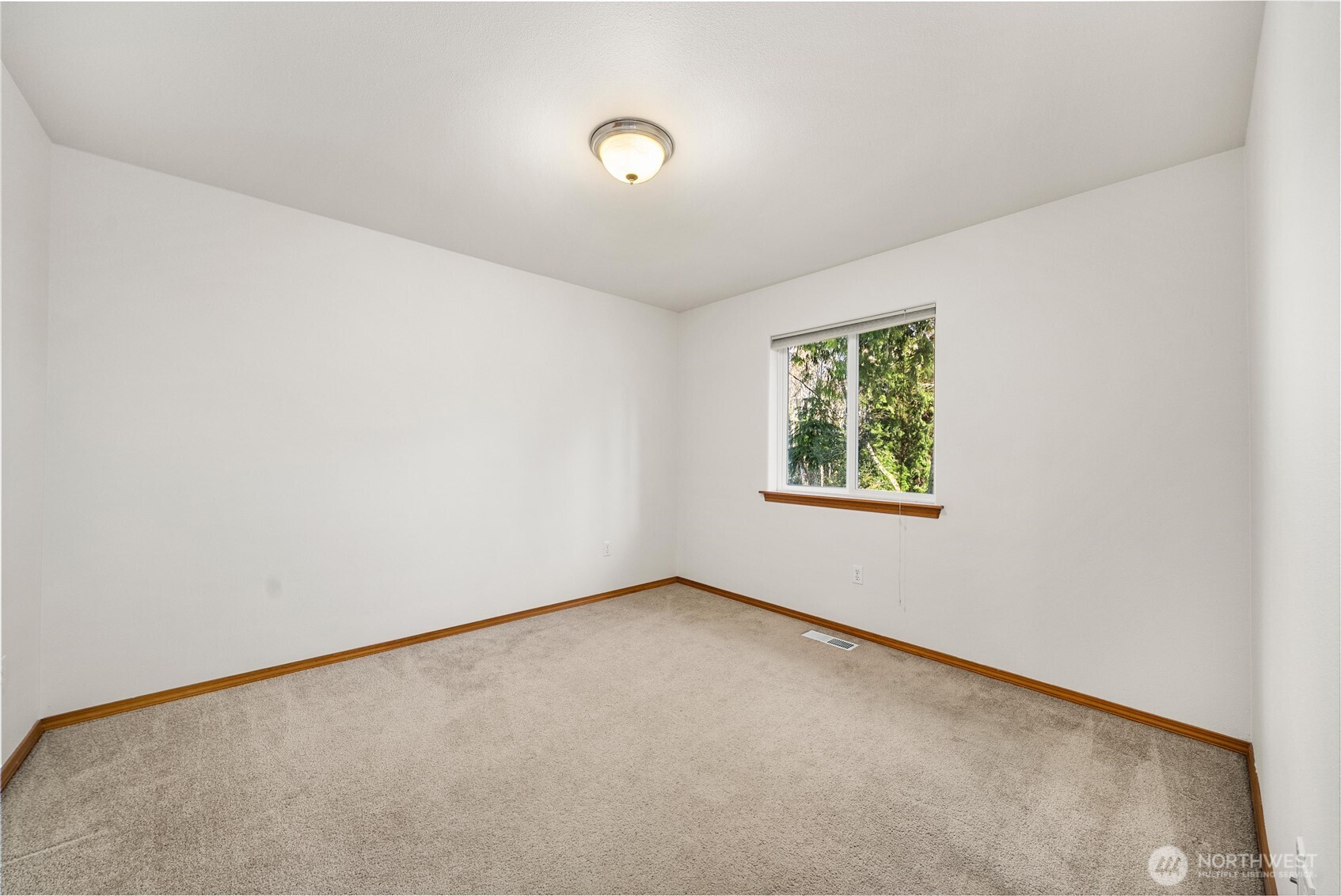 7626 78th Loop Northwest Olympia, WA 98502 - Photo 21 of 38 an empty room with windows
