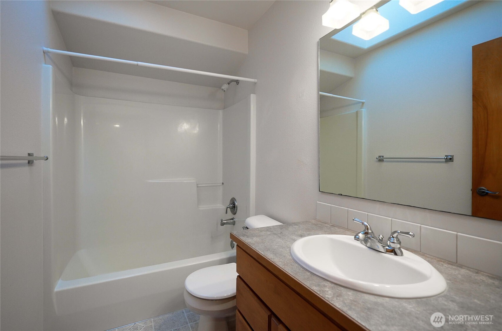 7626 78th Loop Northwest Olympia, WA 98502 - Photo 22 of 38 a bathroom with a sink toilet and shower