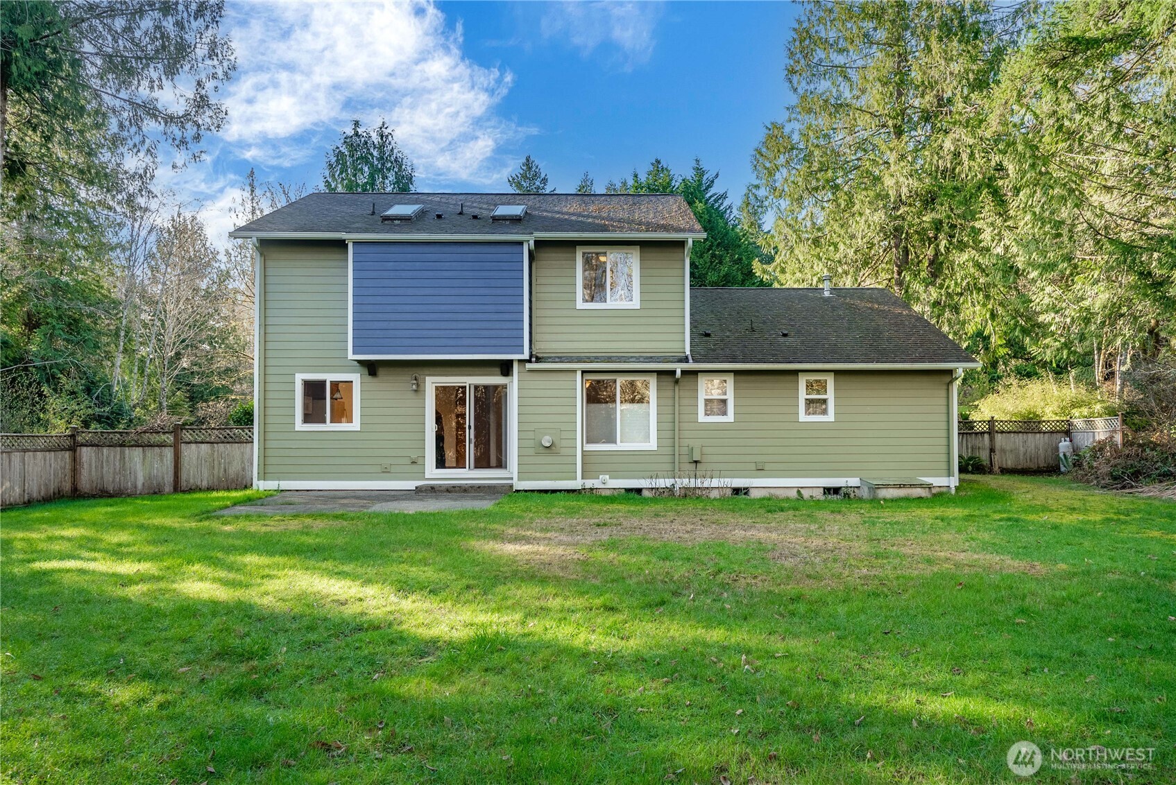 7626 78th Loop Northwest Olympia, WA 98502 - Photo 24 of 38 a front view of a house with a garden