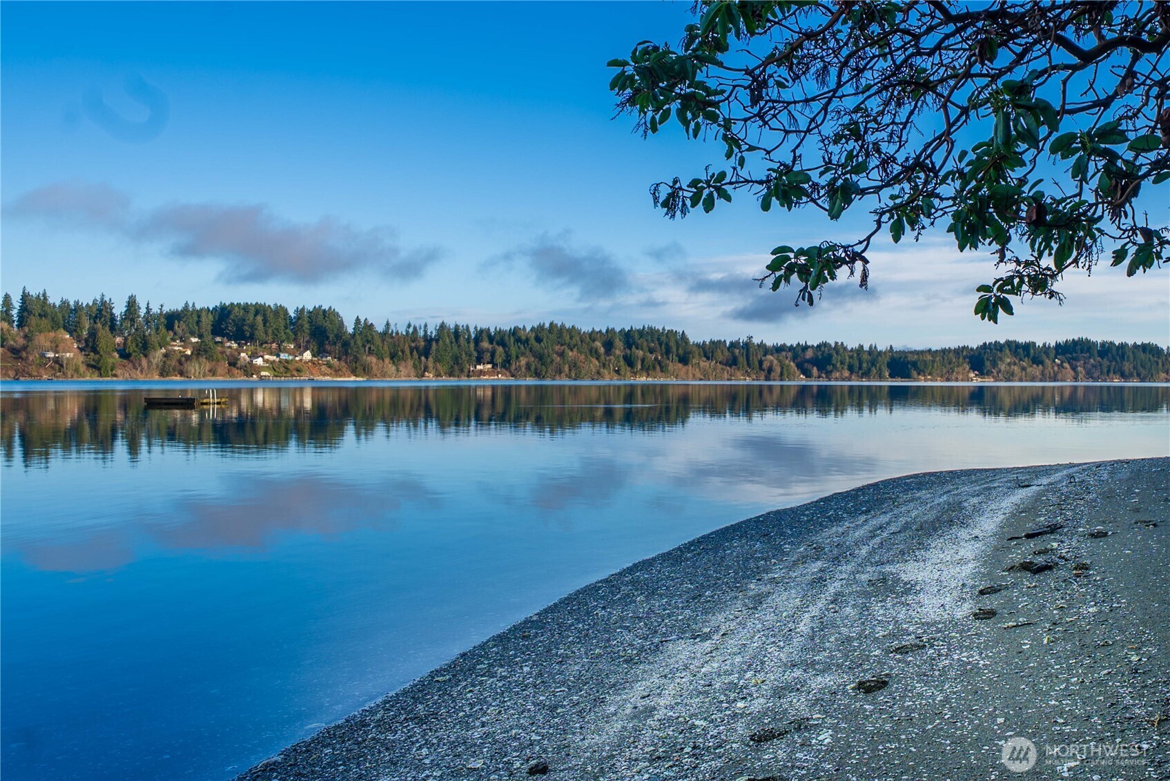 7626 78th Loop Northwest Olympia, WA 98502 - Photo 35 of 38 a view of a lake with houses in the back