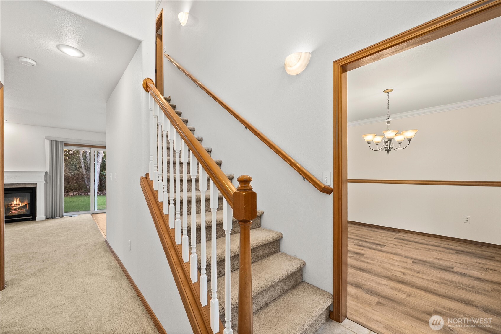 7626 78th Loop Northwest Olympia, WA 98502 - Photo 4 of 38 a view of staircase with wooden floor and a chandelier