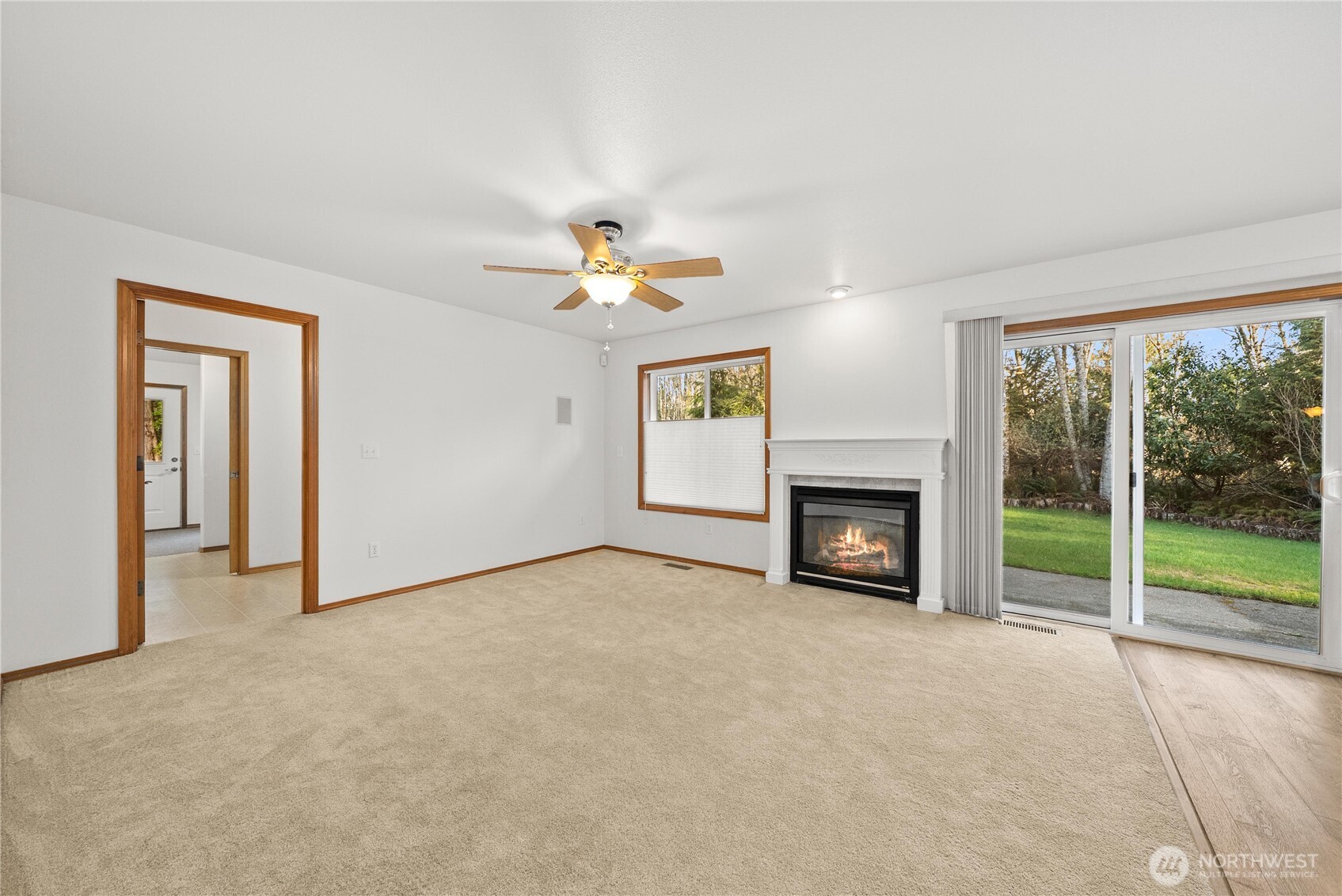 7626 78th Loop Northwest Olympia, WA 98502 - Photo 5 of 38 a view of an empty room with window and fire place