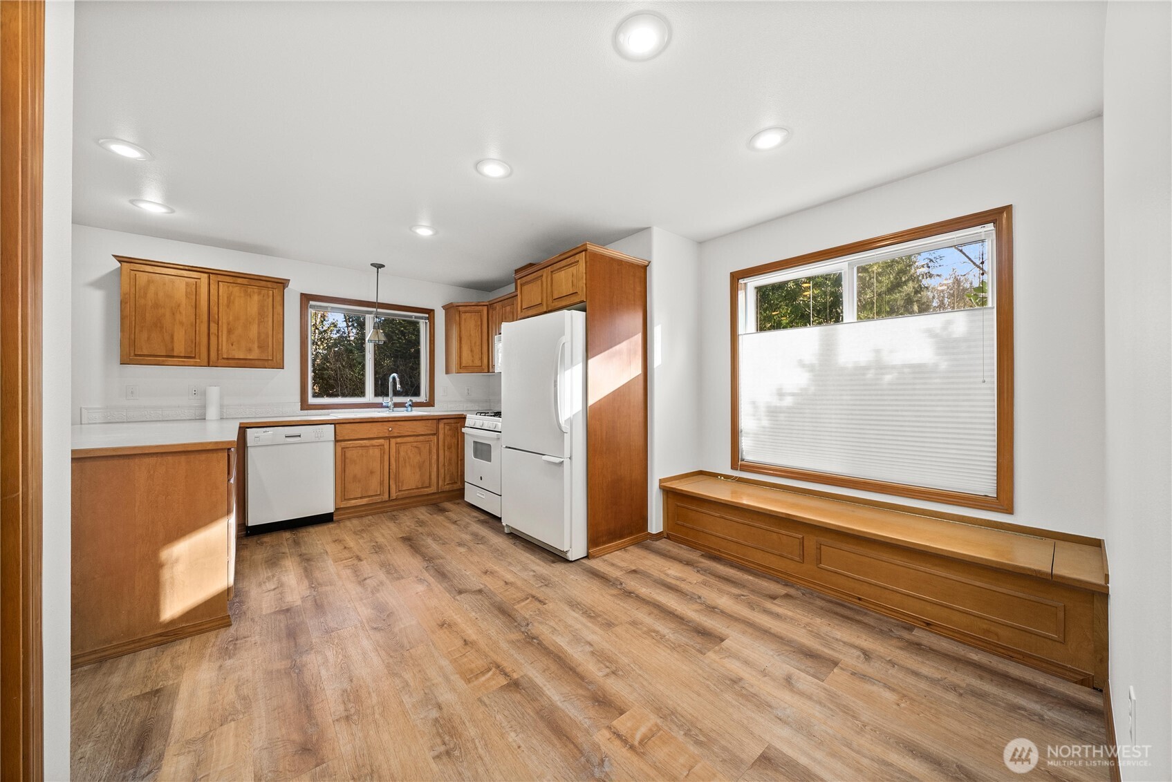 7626 78th Loop Northwest Olympia, WA 98502 - Photo 10 of 38 a kitchen with stainless steel appliances a refrigerator and a stove top oven