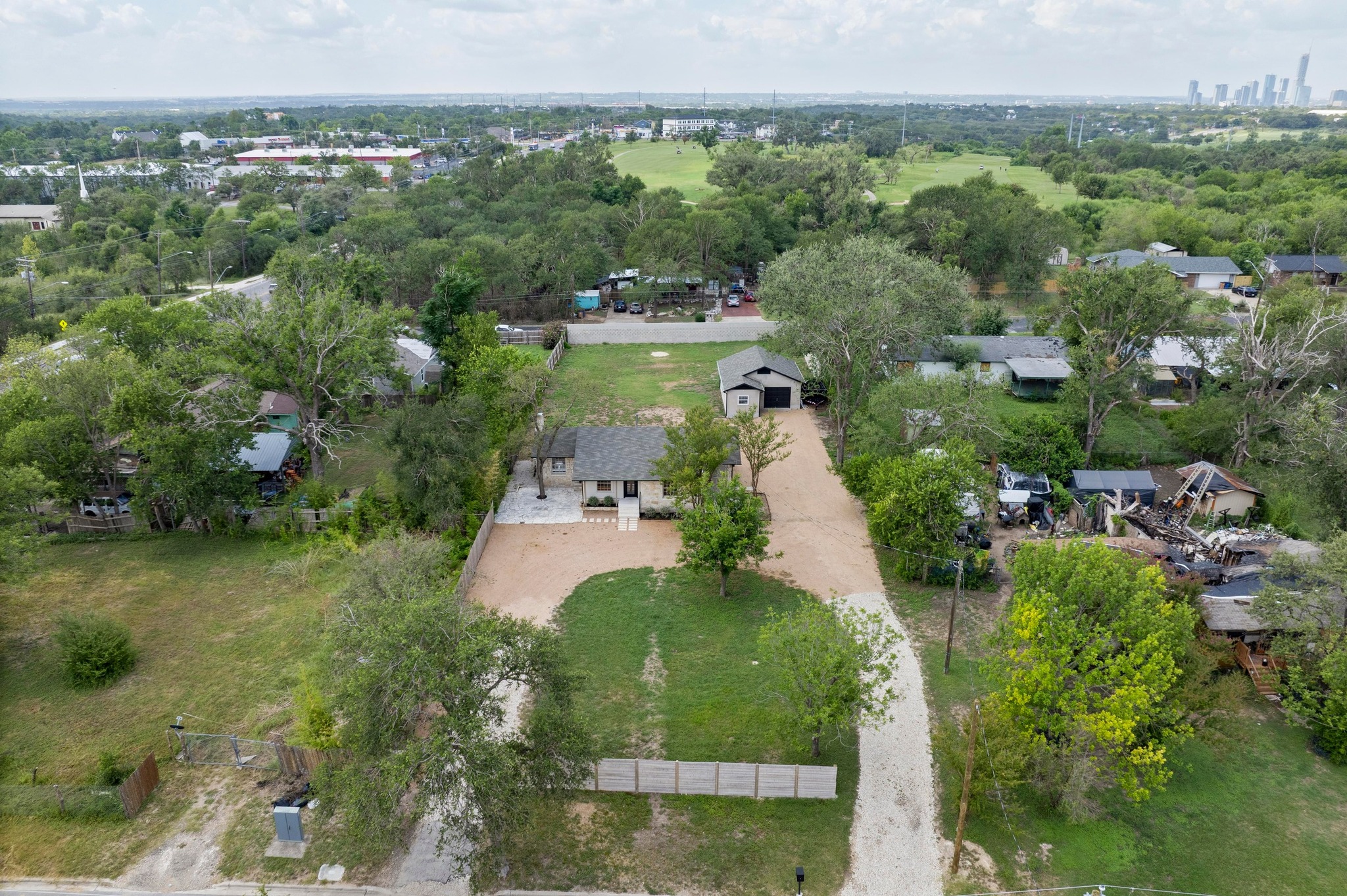 3501 Pecan Springs Road Austin, TX 78723 - Photo 40 of 40 Aerial overview of property's location featuring nearby suburban area and a tree filled landscape