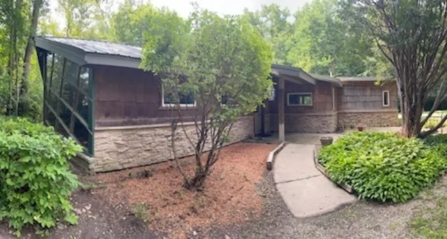 a backyard of a house with lots of green space