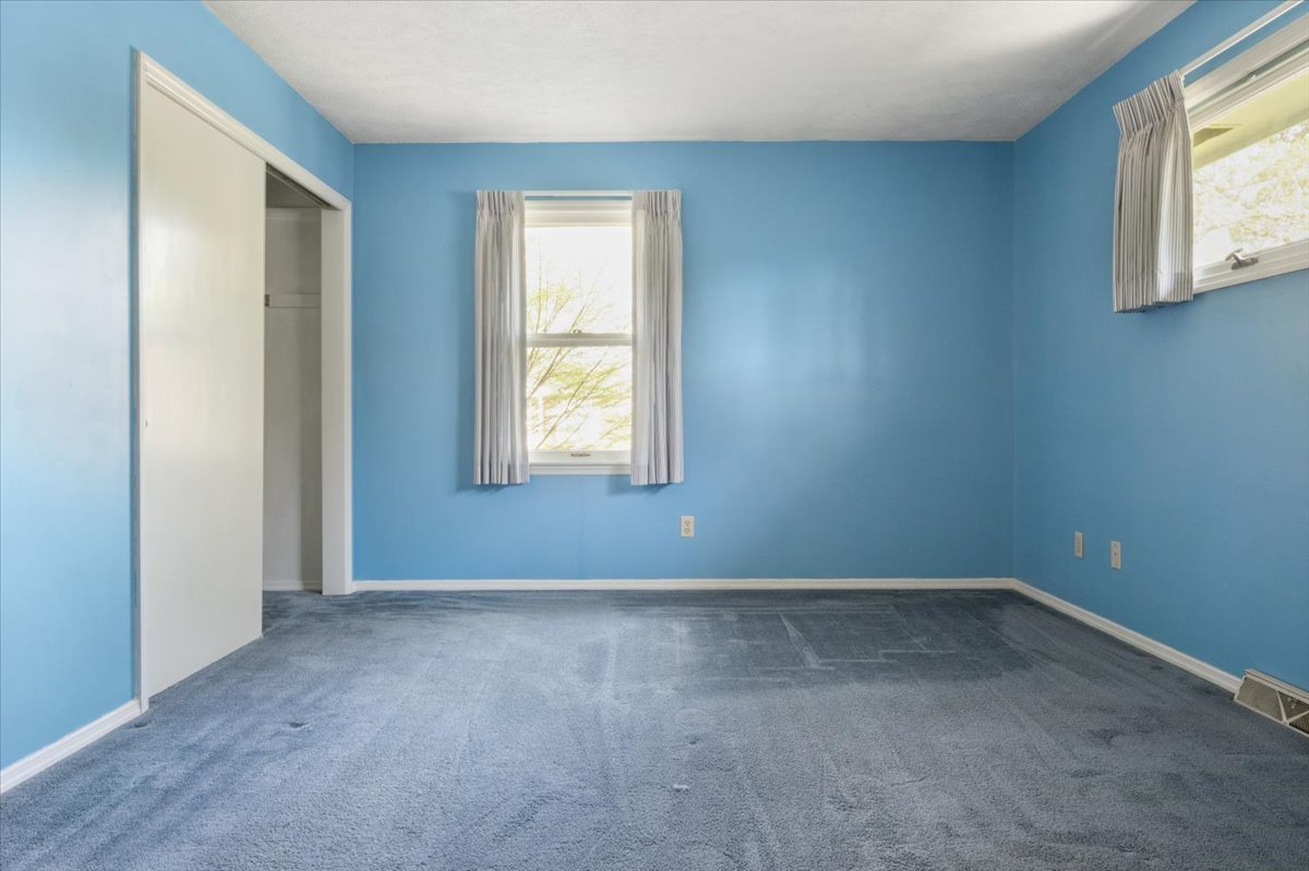 213 Concord Drive Normal, IL 61761 - Photo 13 of 21 an empty room with windows