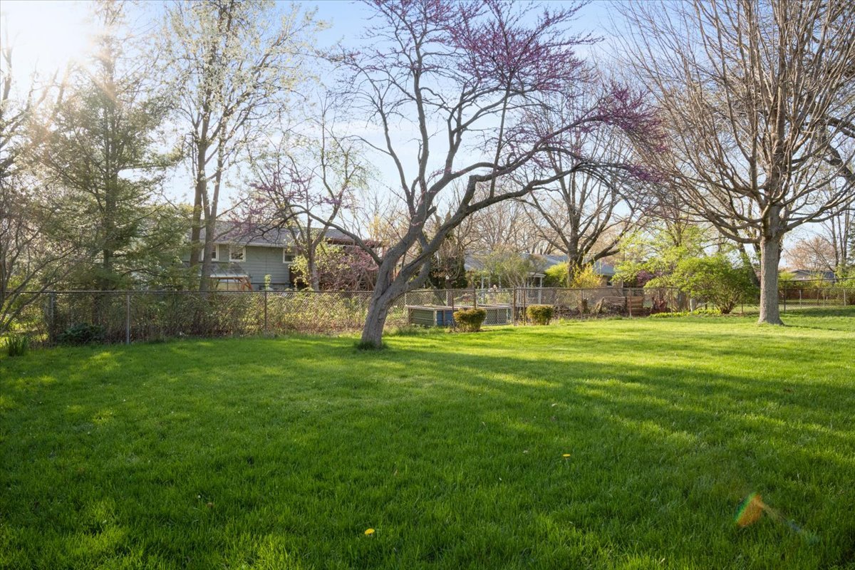 213 Concord Drive Normal, IL 61761 - Photo 2 of 21 a huge green field with lots of trees