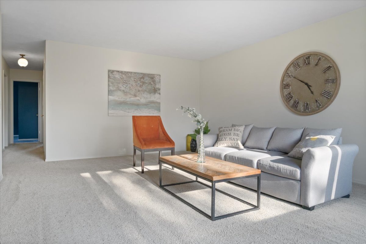 213 Concord Drive Normal, IL 61761 - Photo 3 of 21 a living room with furniture and a wall painting