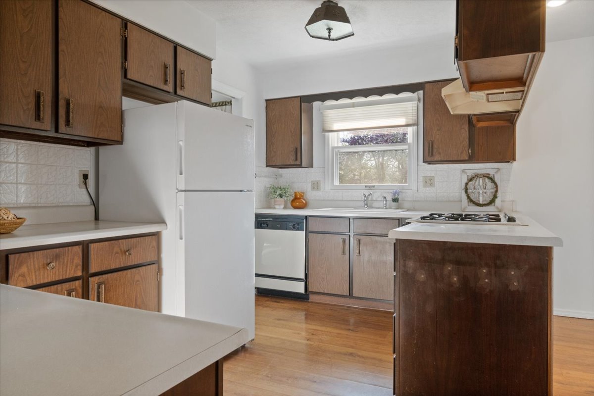 213 Concord Drive Normal, IL 61761 - Photo 5 of 21 a kitchen with a sink a refrigerator and cabinets
