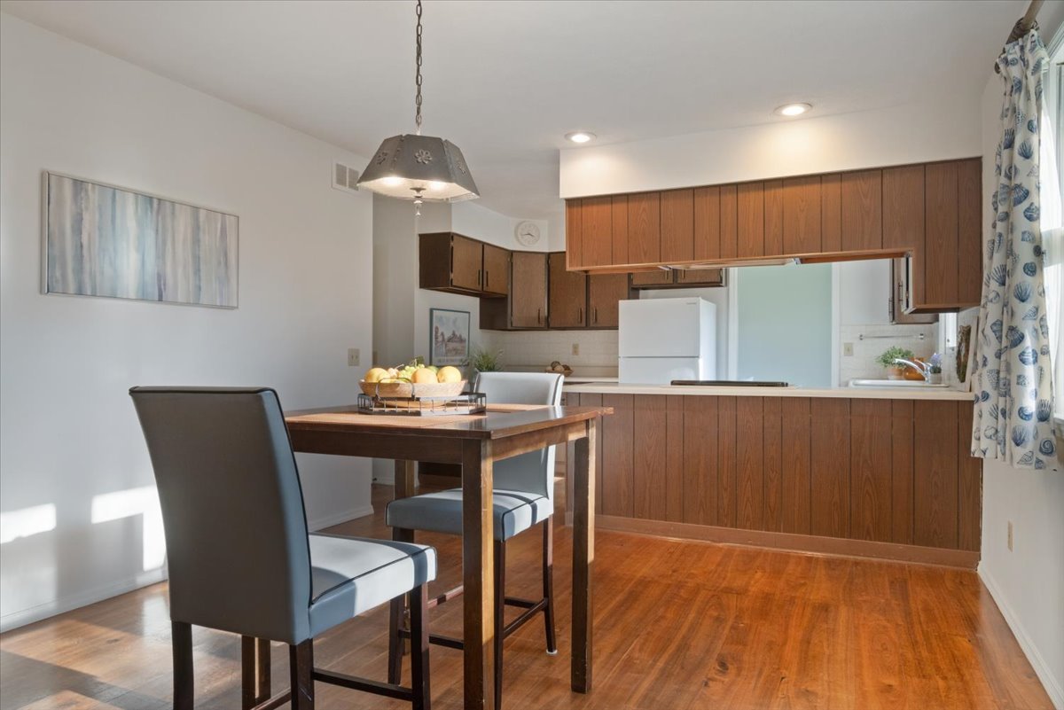 213 Concord Drive Normal, IL 61761 - Photo 6 of 21 a kitchen with kitchen island a dining table and chairs