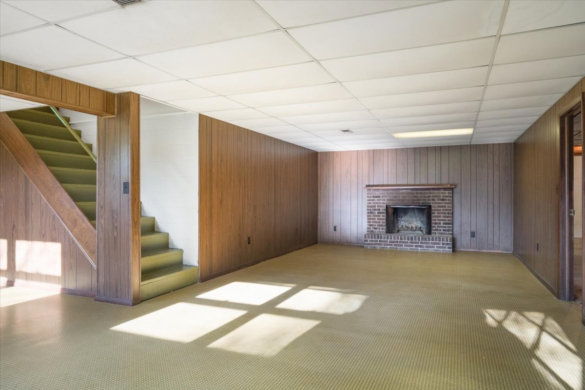 213 Concord Drive Normal, IL 61761 - Photo 7 of 21 a view of an empty room with a fireplace