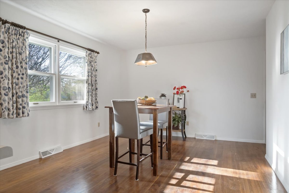 213 Concord Drive Normal, IL 61761 - Photo 10 of 21 a view of a dining room with furniture window and wooden floor